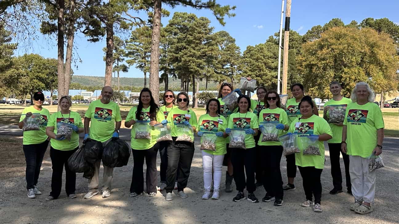 Volunteers picking up cigarette butts to raise awareness of tobacco trash.